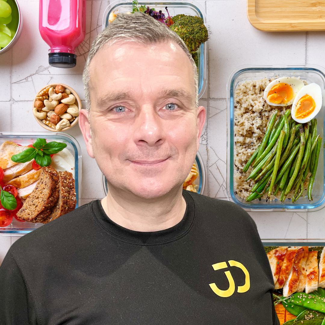 Portrait image of a man with a black t shirt of with healthy nutrition as the background.